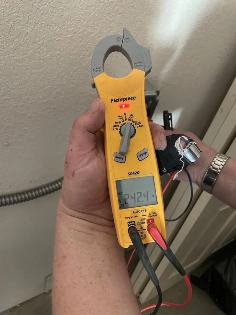 Voltage testing with clamp meter during Outlet Installation in Mission